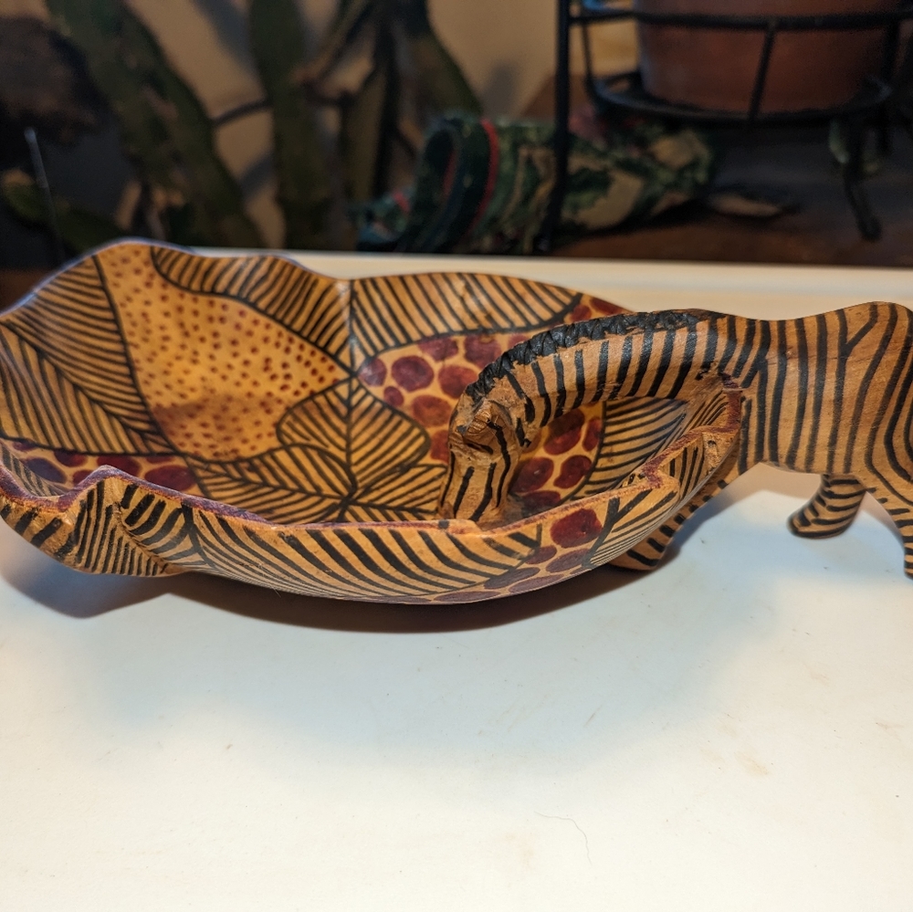 Wood carved bowl with zebra handle